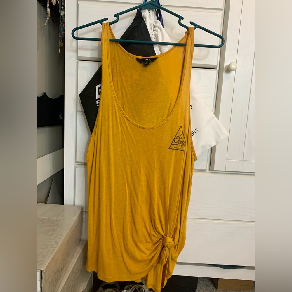 Obey size medium tank.